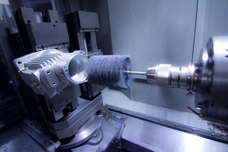 CNC Machining: Versatile, flexible honing tool used for cross hole deburring and all around the shop
