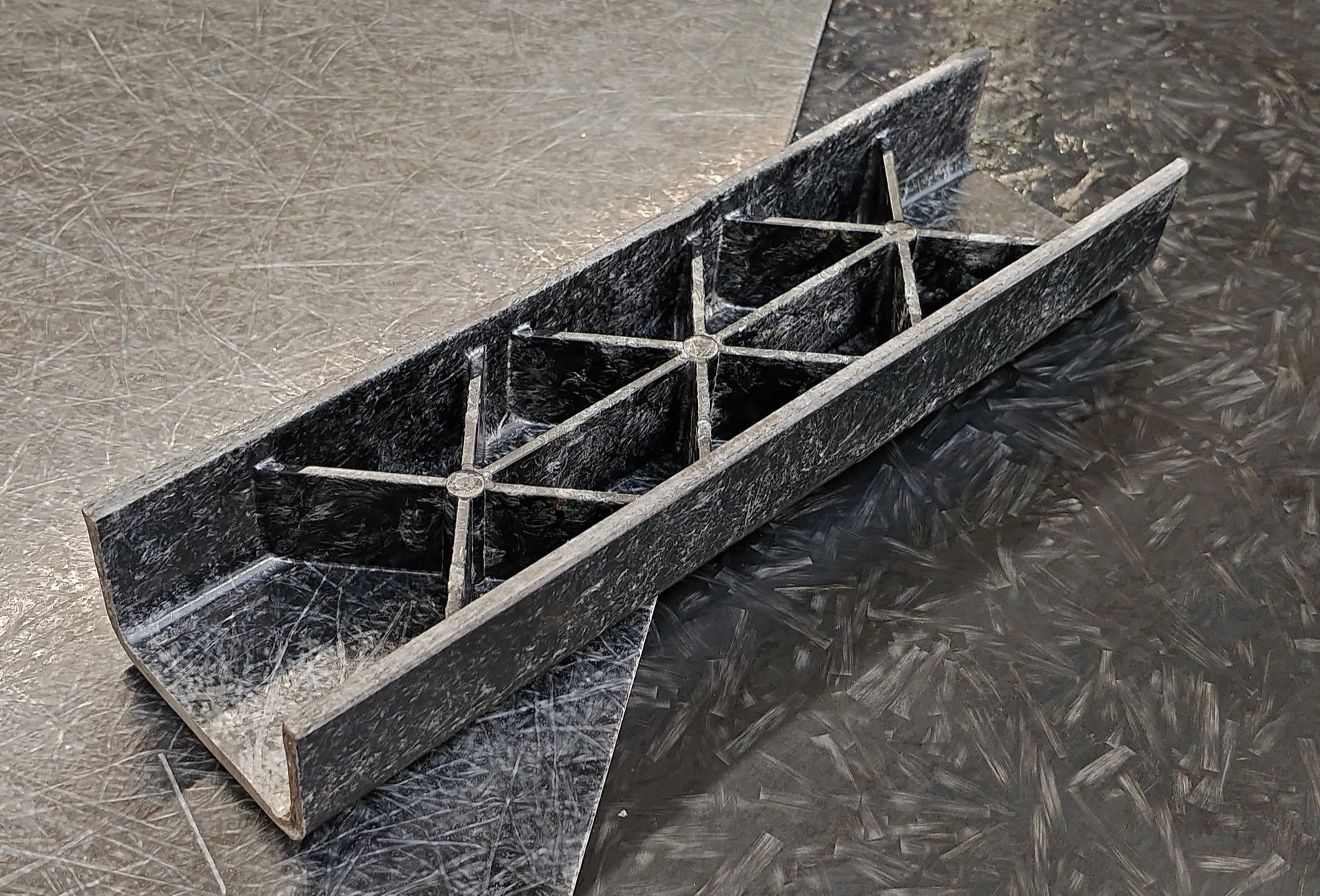 Improved structural performance of long fibre composites
