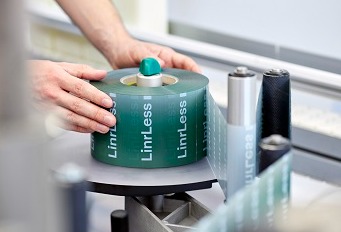 Decorative linerless labels cut packaging waste