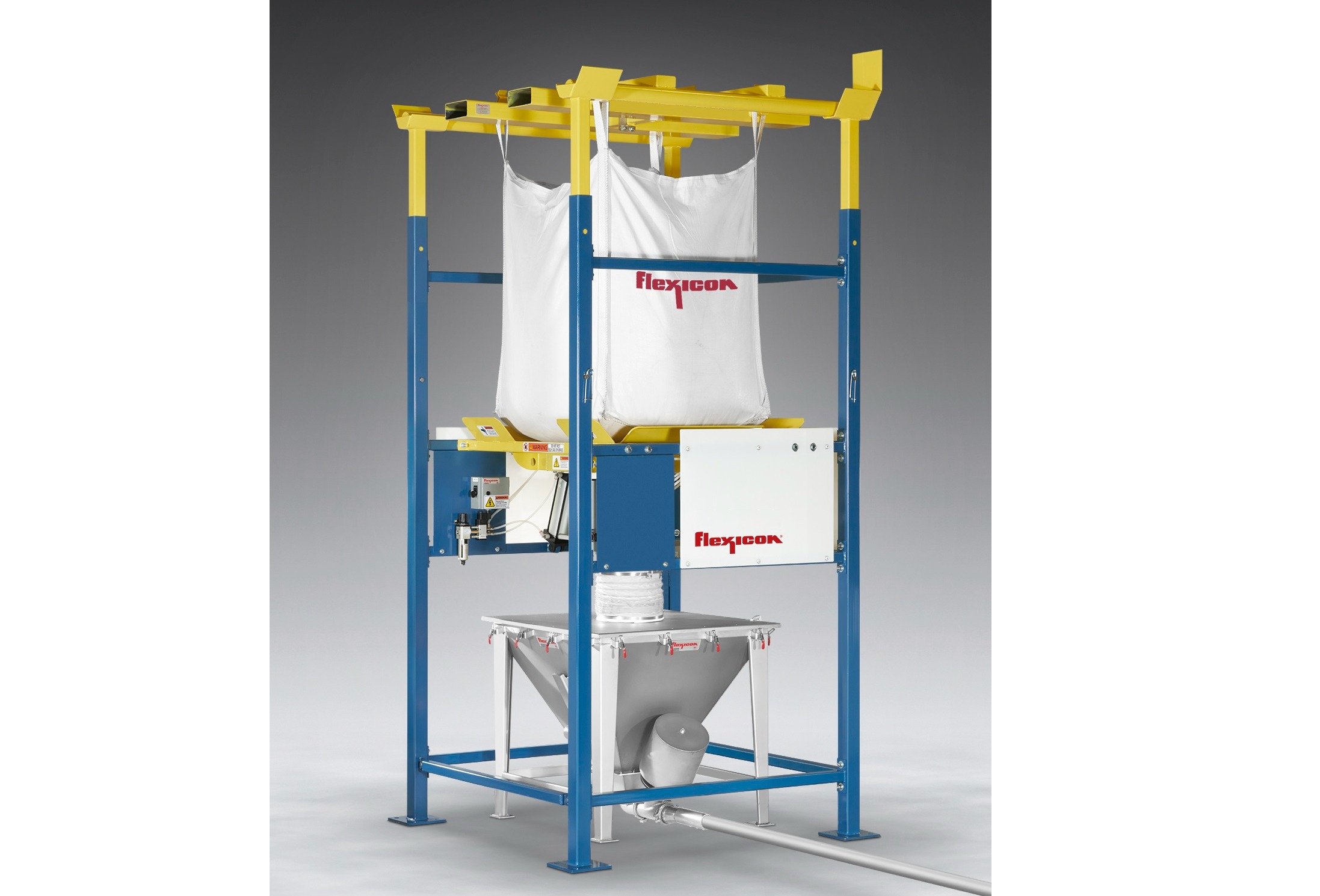 Bulk bag discharger feeds vacuum lines dust-free
