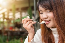 Woman eating white food-Creative Commons Zero (CC0) - Copy.jpg